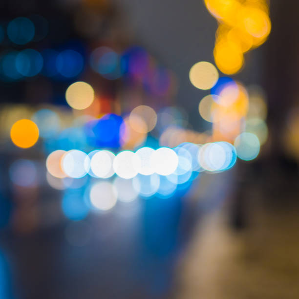 istock Night road with car lights and lamplight - blurred bright background with blue hues 1160560573