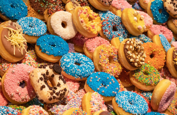 istock Doughnuts with colorful decoration background. Closeup view 1160561269