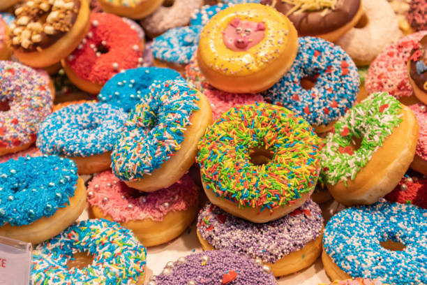 istock Doughnuts with colorful decoration background. Closeup view 1160561285