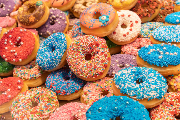 istock Doughnuts with colorful decoration background. Closeup view 1160561286