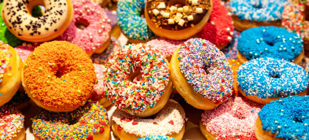 istock Doughnuts with colorful decoration background. Closeup view 1160561289
