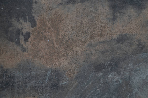 istock Dark gray old cement wall background close up 1160561359