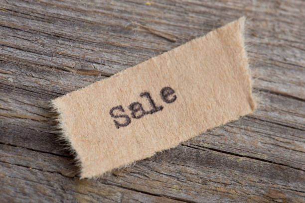 istock Sale typed text on a paper, real estate concept 1160563701