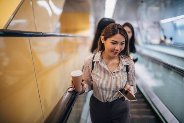 istock Best friends on escalator 1160566396
