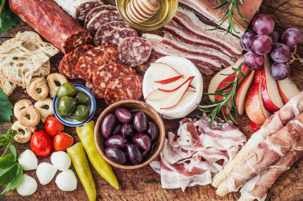 istock Italian appetizers on wooden board. 1160566463