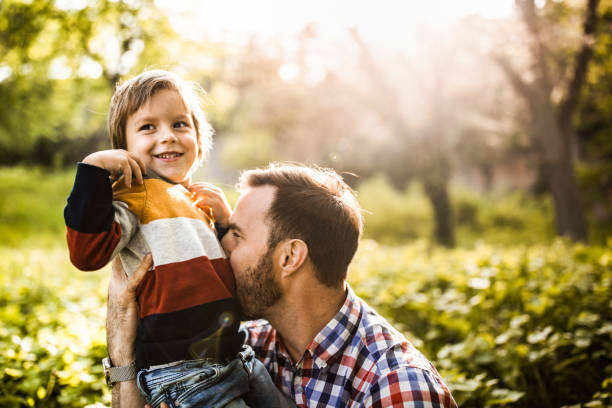 istock Happy little boy having fun with his father in nature. 1160566702