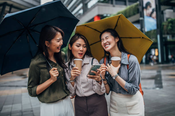 istock Women using smart phone on the street 1160566705