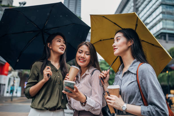 istock Women using smart phone on the street 1160567218