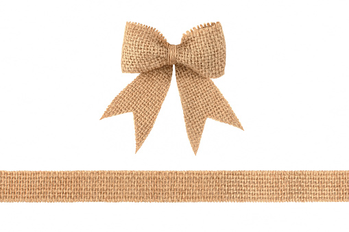 Vintage burlap ribbon bow for gift decoration isolated on white background