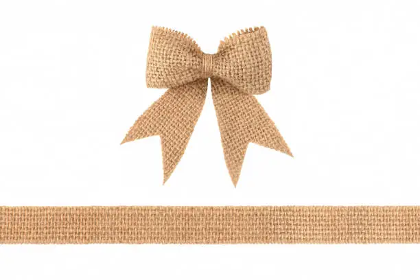 Vintage burlap ribbon bow for gift decoration isolated on white background