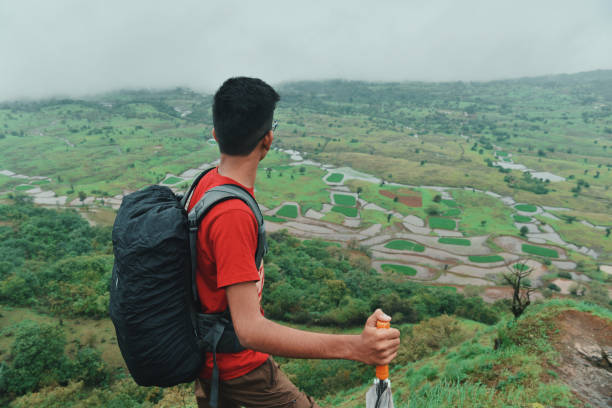 istock Teenage boy looking at the view while hiking 1160569761