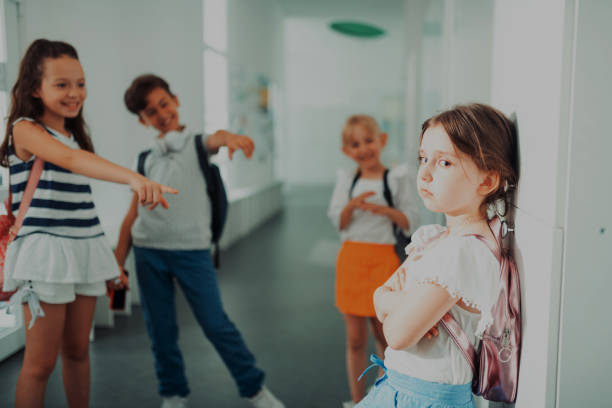 istock Little girl feeling lonely and stressed suffering from mockery 1160570023