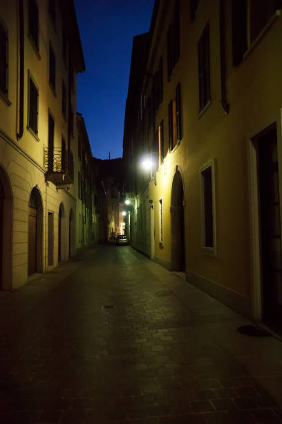 istock Illuminated lonely street at night. 1160571078