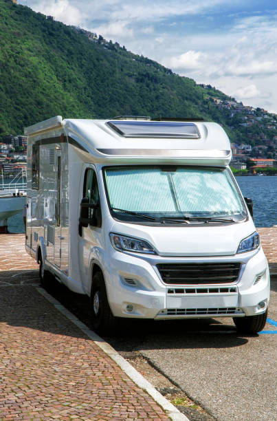 istock Campervan car standing on parking lot. 1160571115