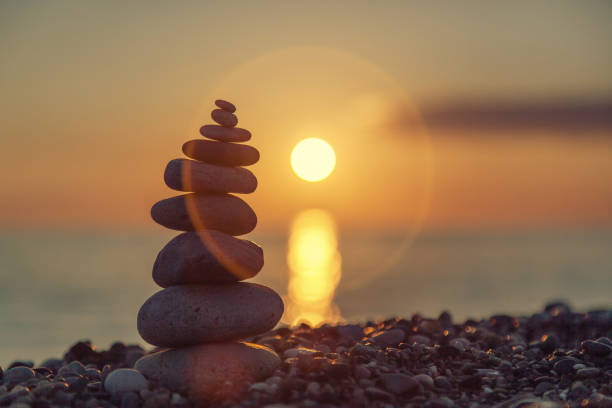istock The rock cairn on the beach, on a beautiful bright sunset 1160573652