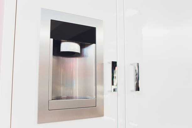 istock Refrigerator Ice and Water Dispenser modern front design close-up. 1160574191