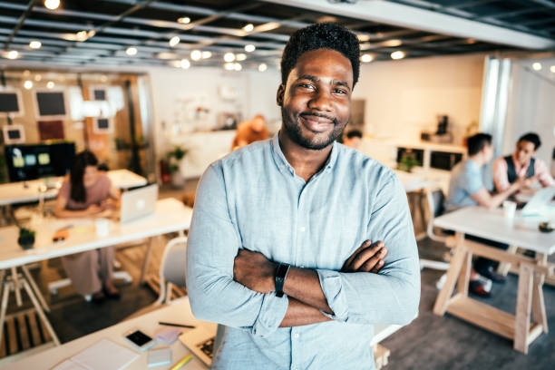 istock Cheerful Man Enjoying co-working Atmosphere In Office 1160575532