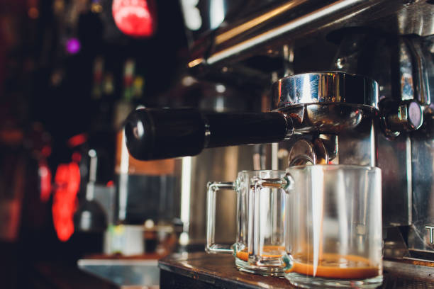 istock Fresh coffee prepared in the coffee machine. Espresso in small white cups. 1160577897