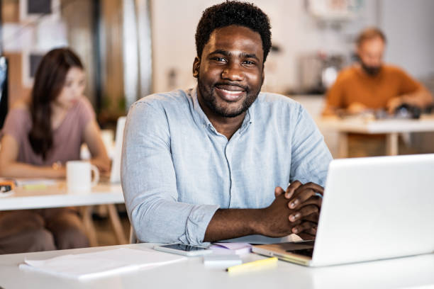 istock Cheerful Man Enjoying co-working Atmosphere In Office 1160580462
