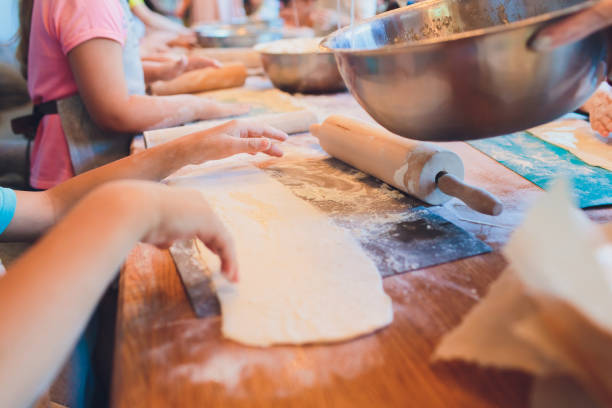 istock Children's master class in cooking pizza flour. 1160580752