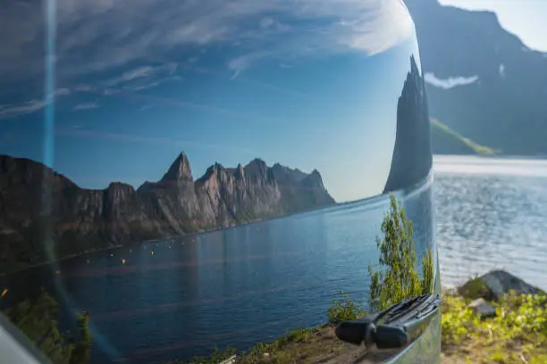 landscape reflection in the rear window of a car. Norway,island Senja