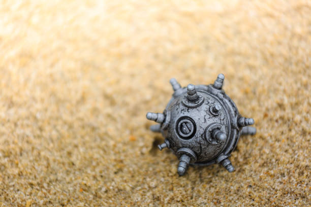 silver color plastic mine toy on the sands