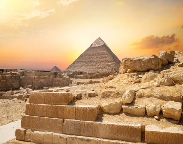 istock Egyptian pyramid in sand 1160583555