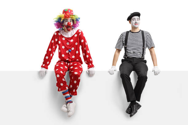 istock A clown and a mime sitting on a panel 1160584377