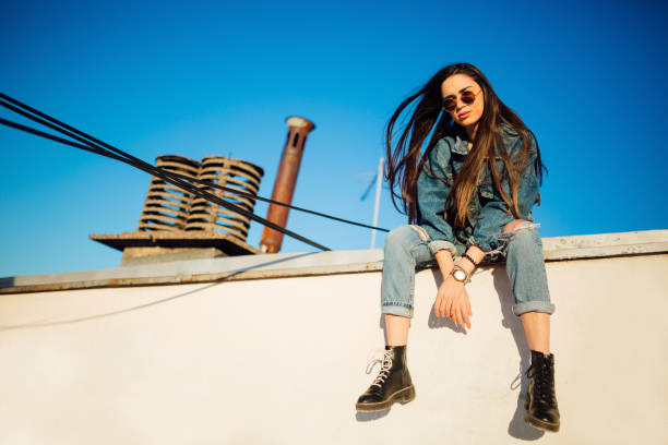 istock A young woman sitting on the rooftop 1160586713