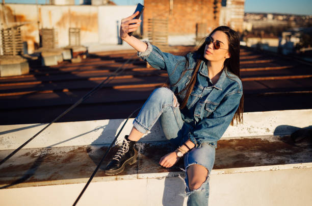 istock A young woman sitting on the rooftop 1160586738