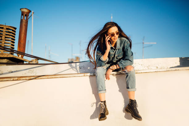 istock A young woman sitting on the rooftop 1160586749