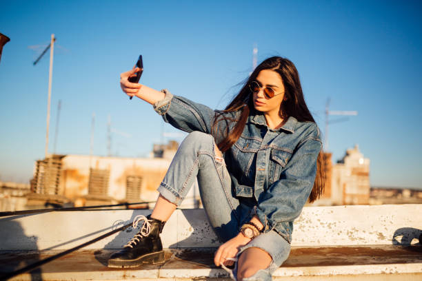 istock A young woman sitting on the rooftop 1160586751