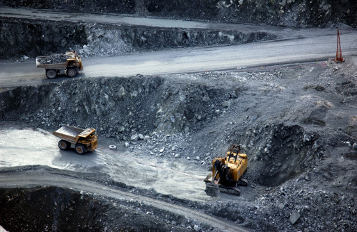 Mine vehicles in open pit mine.