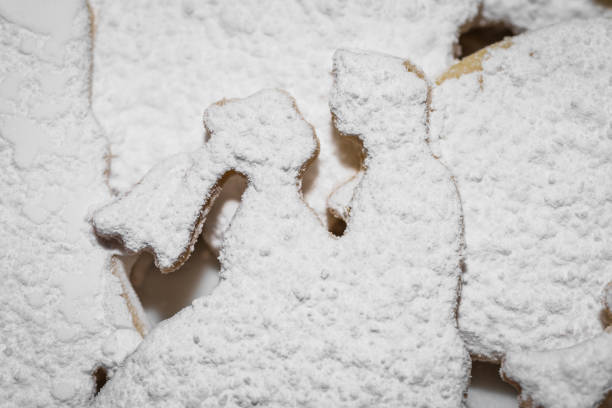 istock Baked wedding biscuits in the form of bride and groom dusted with icing sugar 1160589639