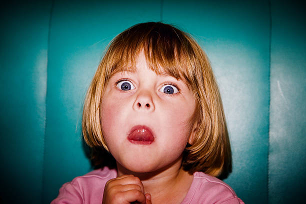 istock Small girl putting her tongue out pulling face 116059548
