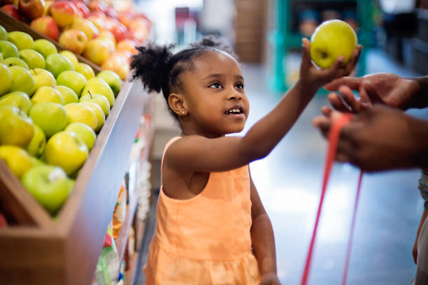 istock Little girl in zero waste oriented fruit and grocery store. 1160595520