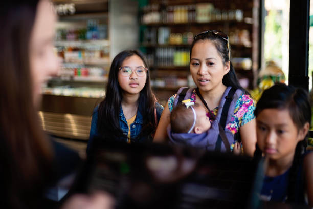 istock Customers shopping in small zero waste oriented fruit and grocery store. 1160595599