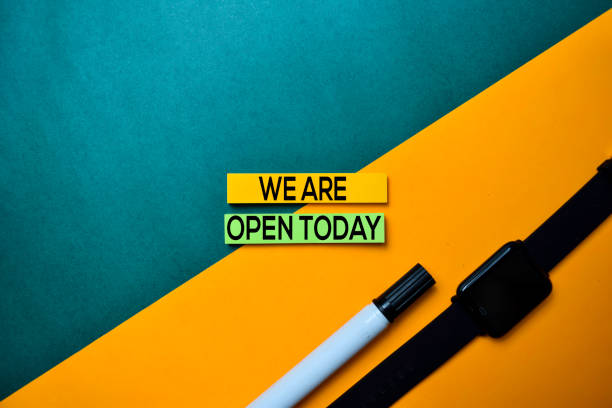 we are open today text on top view color table background. - today sticky desk letter imagens e fotografias de stock