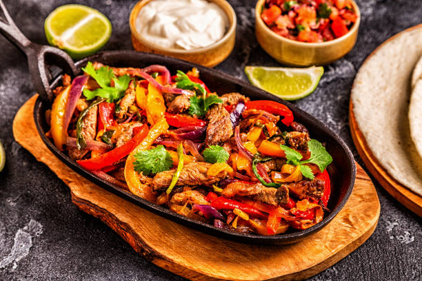 istock FAJITAS with colored pepper and onions 1160598403