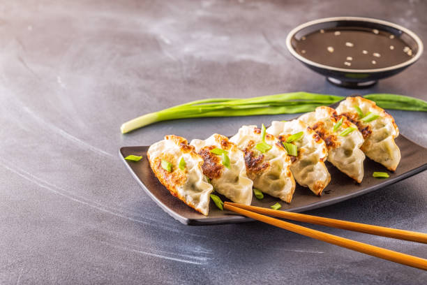 istock Gyoza or dumplings snack with soy sauce, selective focus 1160598472