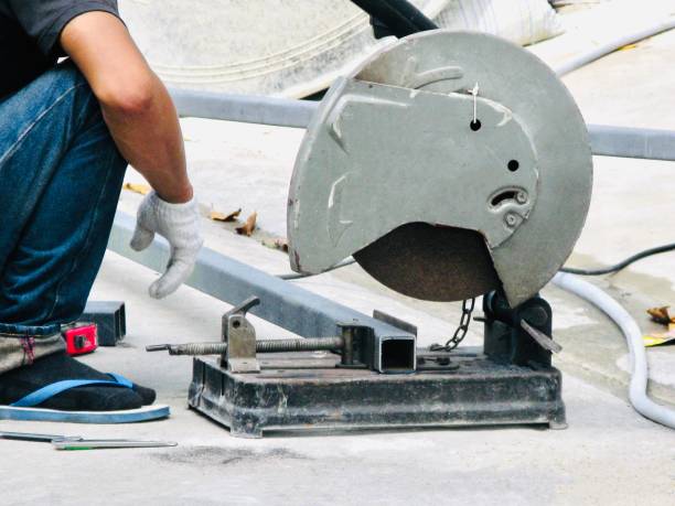 istock Worker Cutting Steel Tube by Cut off Saw 1160603864