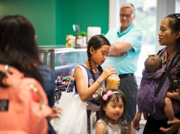 istock Customers in zero waste oriented grocery and take out food store. 1160604219