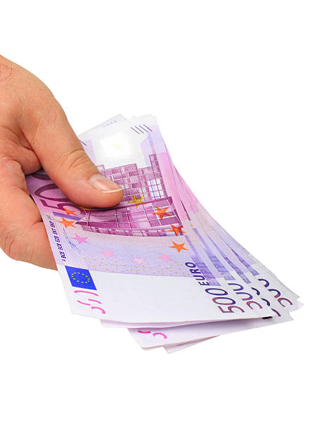 Hand holding euro notes (clipping path included) stock photo