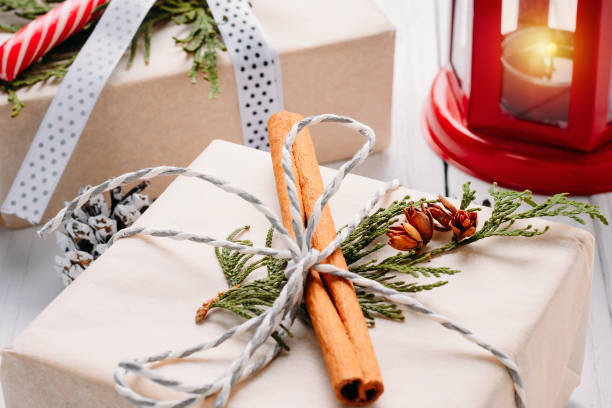 istock Christmas decorations with gift boxes, pine cones and lantern with candle on a white background 1160604329