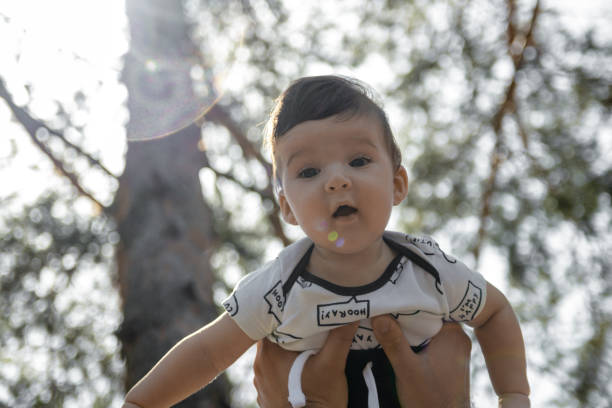 istock Cute baby in fathers arms 1160605119