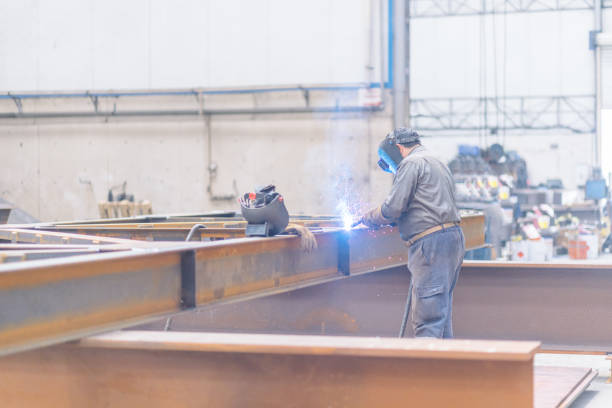 istock Welder works in metal construction 1160607060