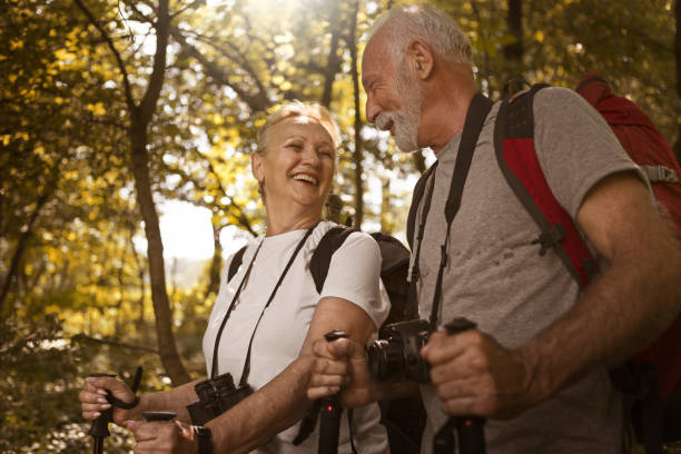 istock Senior couple hiking together in forest 1160609196