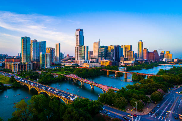 Aerial Drone view above Austin Texas USA Afternoon Sunset Lady Bird Lake 2019 on July 4th Gorgeous afternoon sunset with a clear sky and the entire downtown skyline cityscape across from Town lake or Lady Bird Lake in Austin Texas 2019 kayakers and lake filled with crowds of people on July 4th capital cities stock pictures, royalty-free photos & images