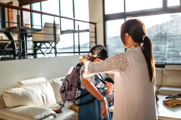 istock Mother preparing his daughter for school 1160611040