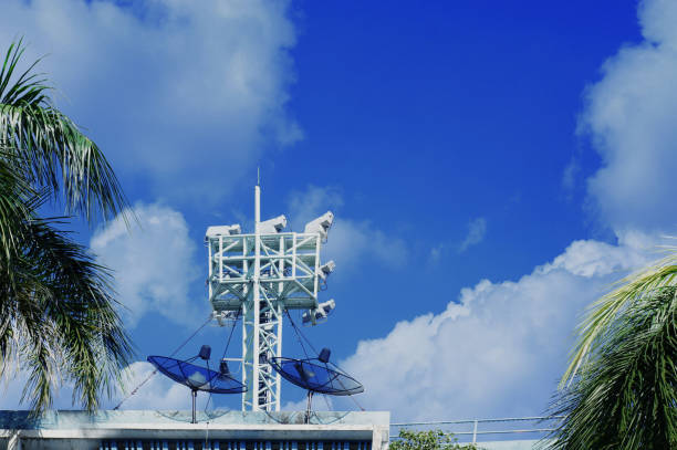 Tower with antennas of cellular communication on blue sky.